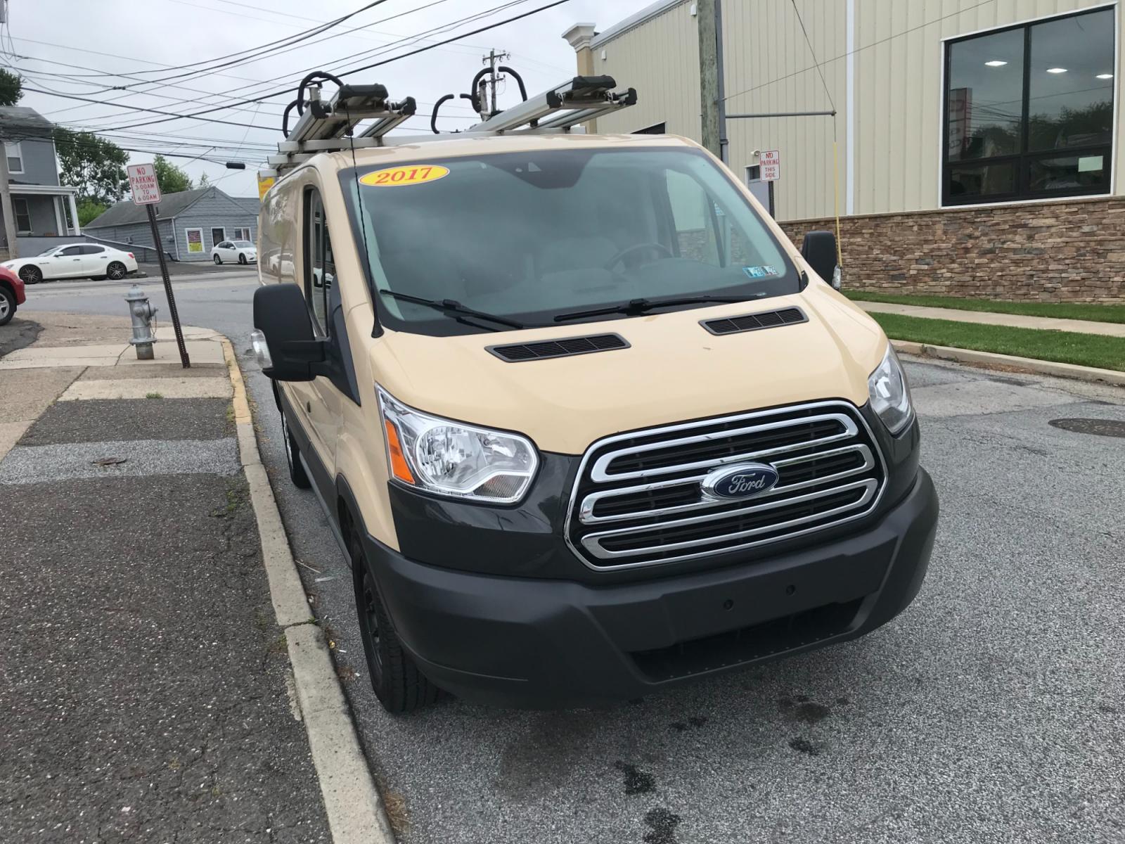 2017 Tan /Gray Ford Transit 150 (1FTYE1YM0HK) with an 3.7 V6 engine, Automatic transmission, located at 577 Chester Pike, Prospect Park, PA, 19076, (610) 237-1015, 39.886154, -75.302338 - 2017 Ford Transit 150: Ladder racks, multiple pieces of shelving, backup camera, partition, power locks and windows, FLEET MAINTAINED, runs LIKE NEW! This vehicle comes inspected and has been given a bumper to bumper safety check. It is very clean, reliable, and well maintained. We offer a unique - Photo #3